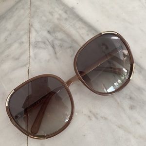 Chloé sunglasses made in Italy.  Brow and gold. Been used before. Good condition